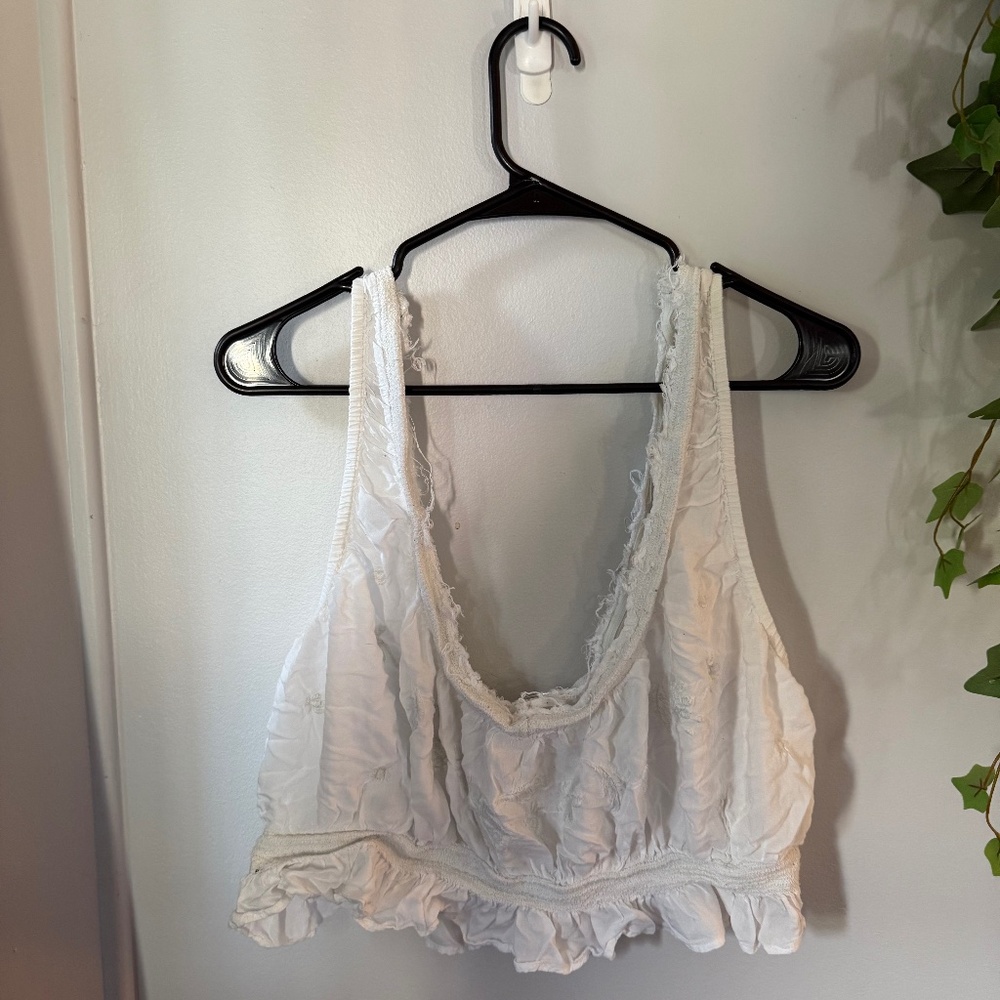 Free People NWOT!! Beautiful, raw-hem, embroidered top